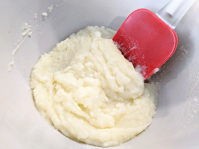 sugar and butter creamed together with spatula in a bowl