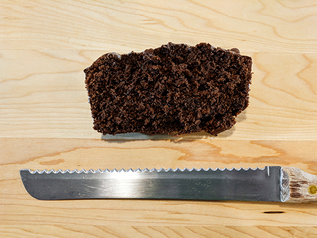 slice of chocolate bread next to bread knife