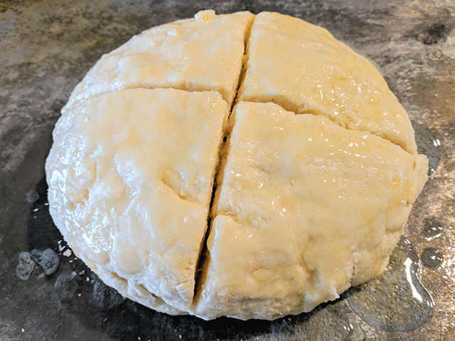Irish Soda Bread Dough Brushed With Butter