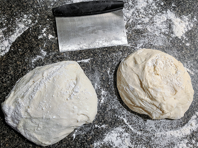 divided sourdough next to pastry cutter for no knead artisan-style sourdough bread