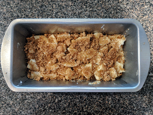 half of apple pie bread batter in pan