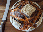 Sourdough Discard Bread next to bread knife on cutting board