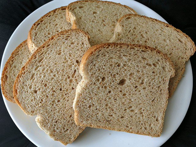 Slices of bread on a plate. Secrets to a softer crust. 