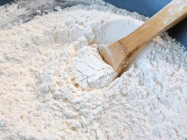 Spoon in a bowl of flour