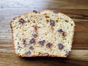 Single Slice of Peanut Butter Chocolate Chip Bread on cutting board