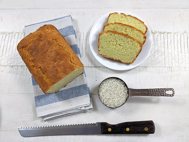 Rice flour bread with rice in measuring cup and bread knife
