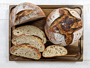 white n wheat sourdough artisan bread on cutting board