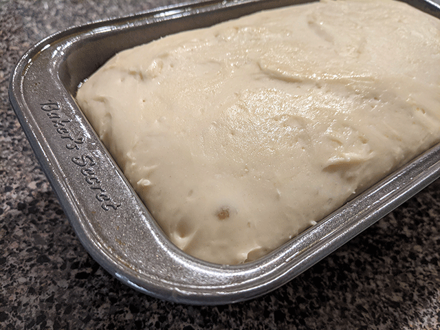english muffin bread dough rising in bread pan