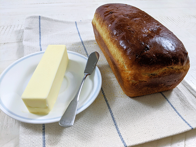english muffin bread next to butter on plate
