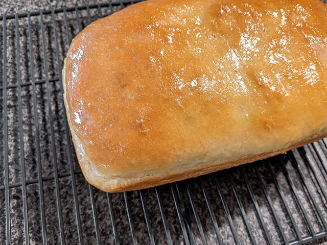 super soft sourdough sandwich bread brushed with butter