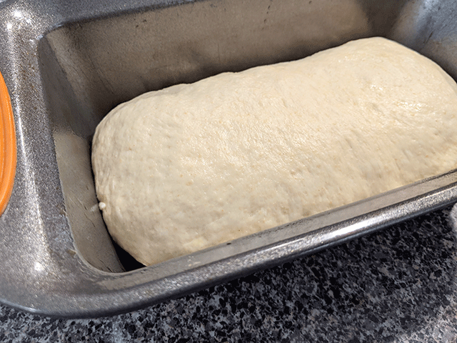 super soft sourdough sandwich bread dough in bread pan