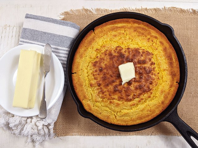 classic skillet cornbread in skillet with butter