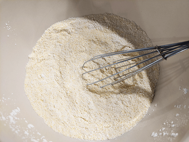 dry ingredient for cornbread with whisk