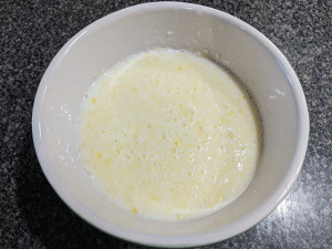 wet ingredients for cornbread in bowl