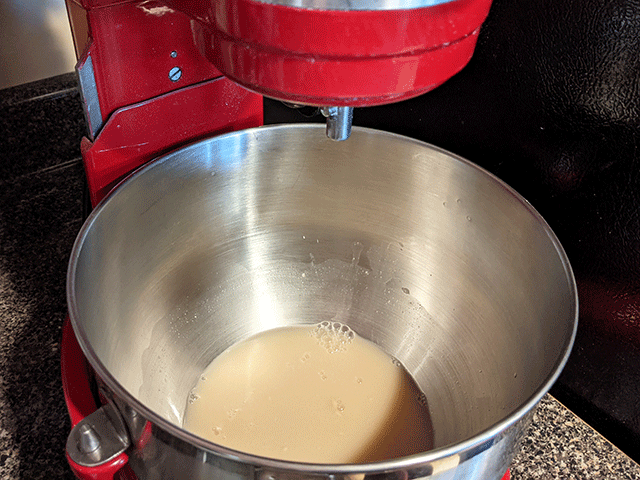 yeast and honey in standing mixer for Honey Wheat and Rye Sourdough Bread