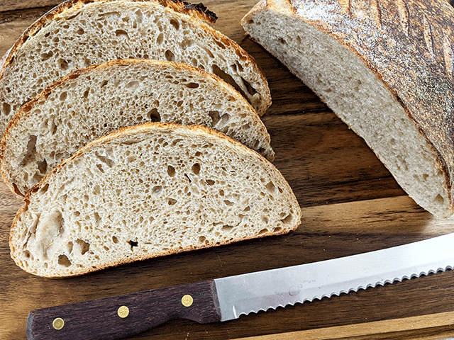 White and Wheat and Rye Artisan Sourdough Bread on Cutting Board
