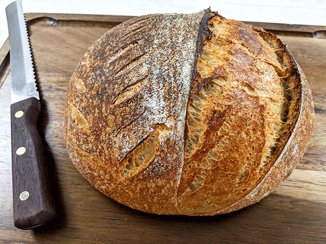 White and Wheat and Rye Artisan Sourdough Bread on Cutting Board