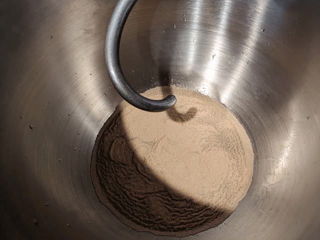 yeast in standing mixer bowl for cinnamon swirl maple oatmeal raisin bread